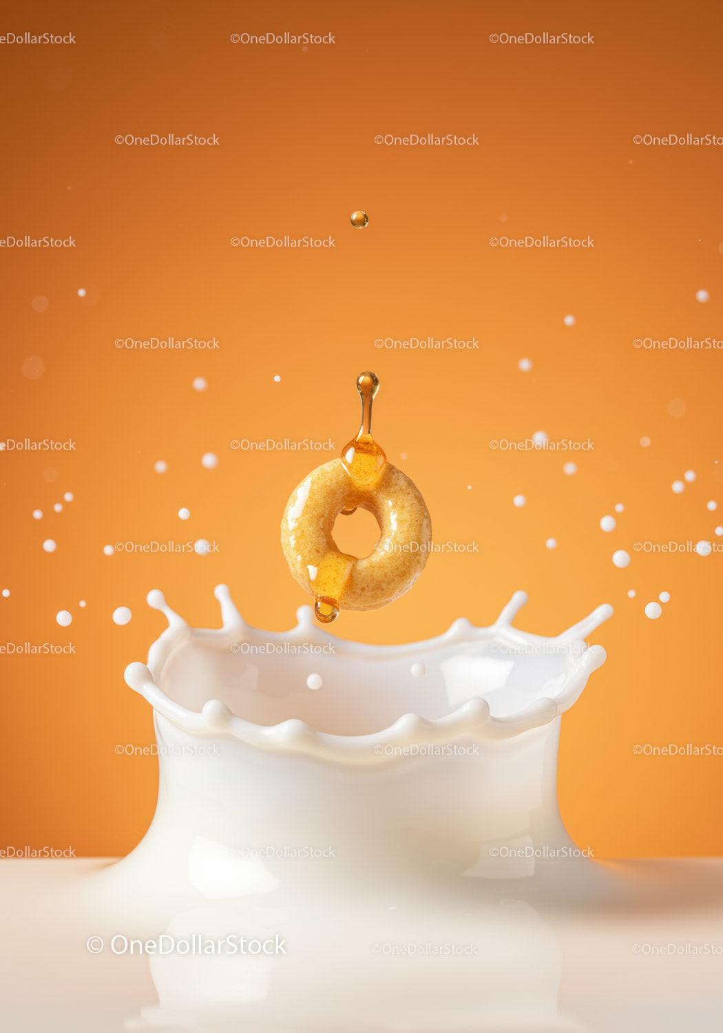 Honey Dripping on Cereal Ring Splashing in Milk
