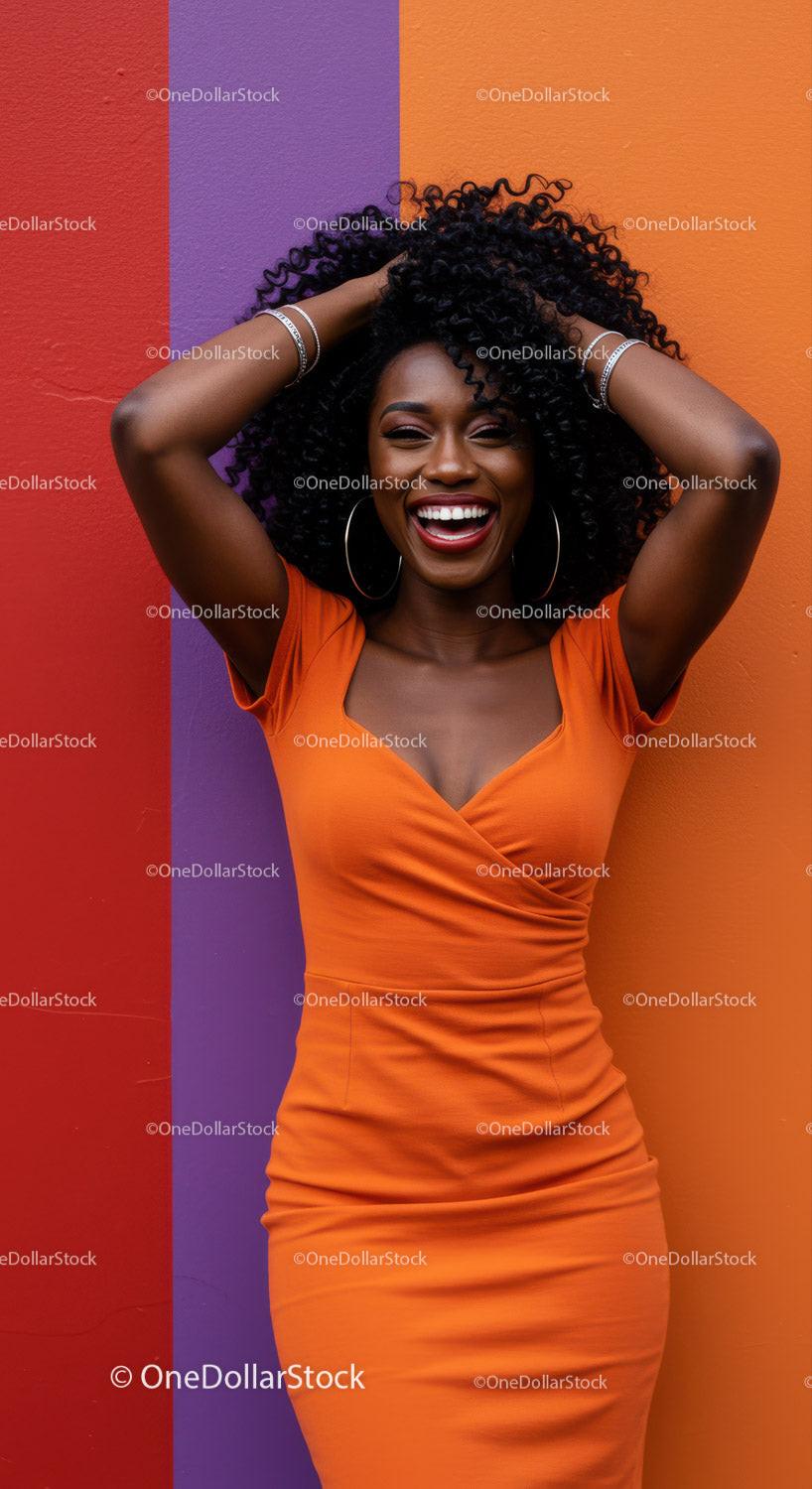 Vibrant Woman in Orange Dress Smiling Against Colorful Wall