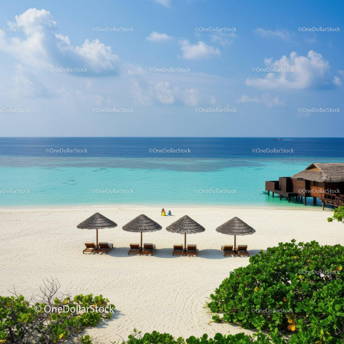 Tropical Beach with Overwater Bungalows and Lounge Chairs Under Blue Sky