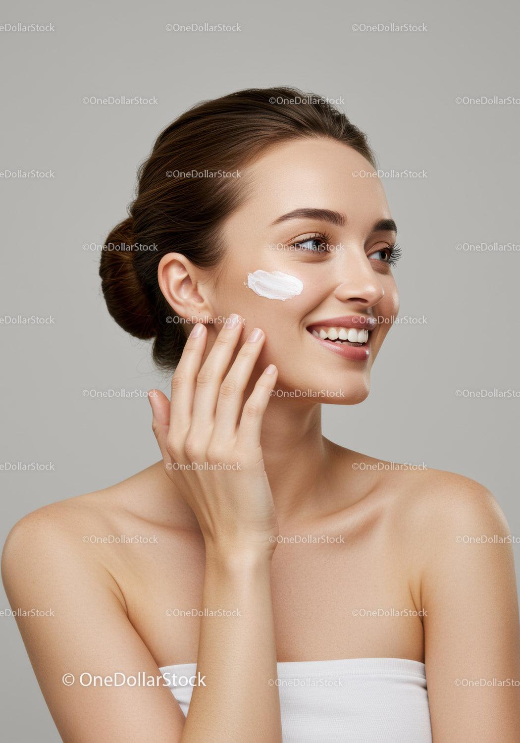 Beautiful Woman Applying Facial Cream for Skincare Routine