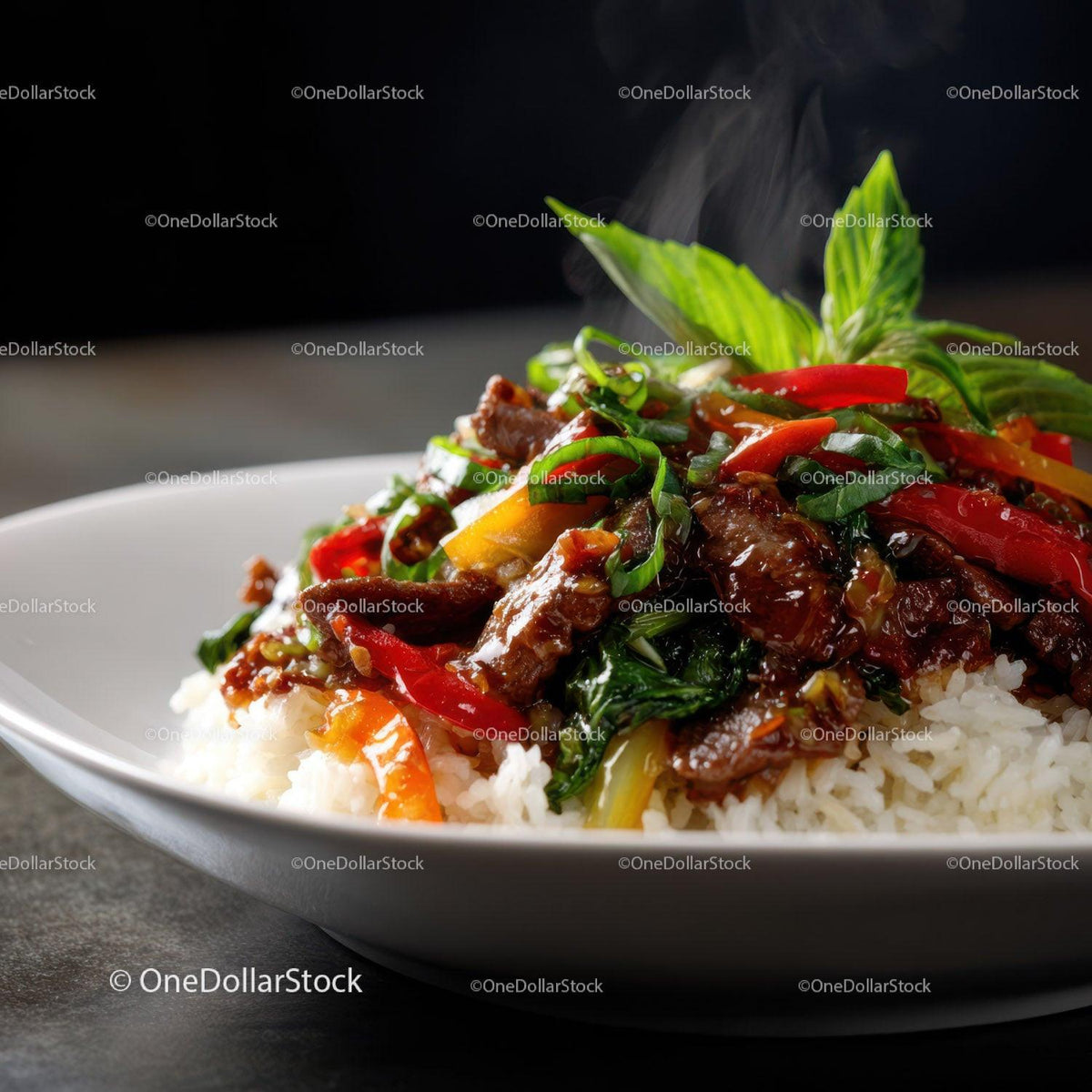 Colorful Beef Stir-Fry Over White Rice with Fresh Basil