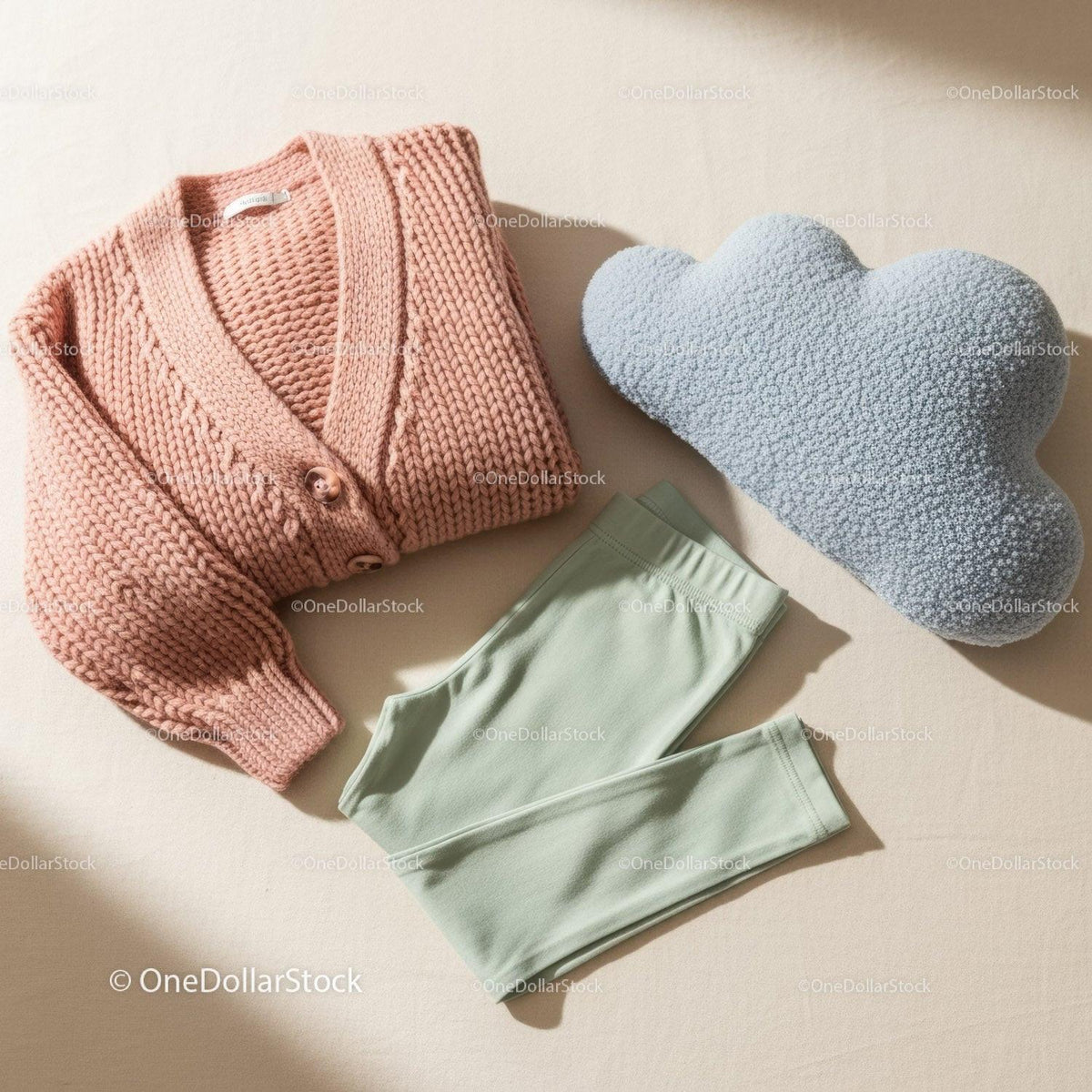 Cozy knitted sweater with soft leggings and cloud pillow