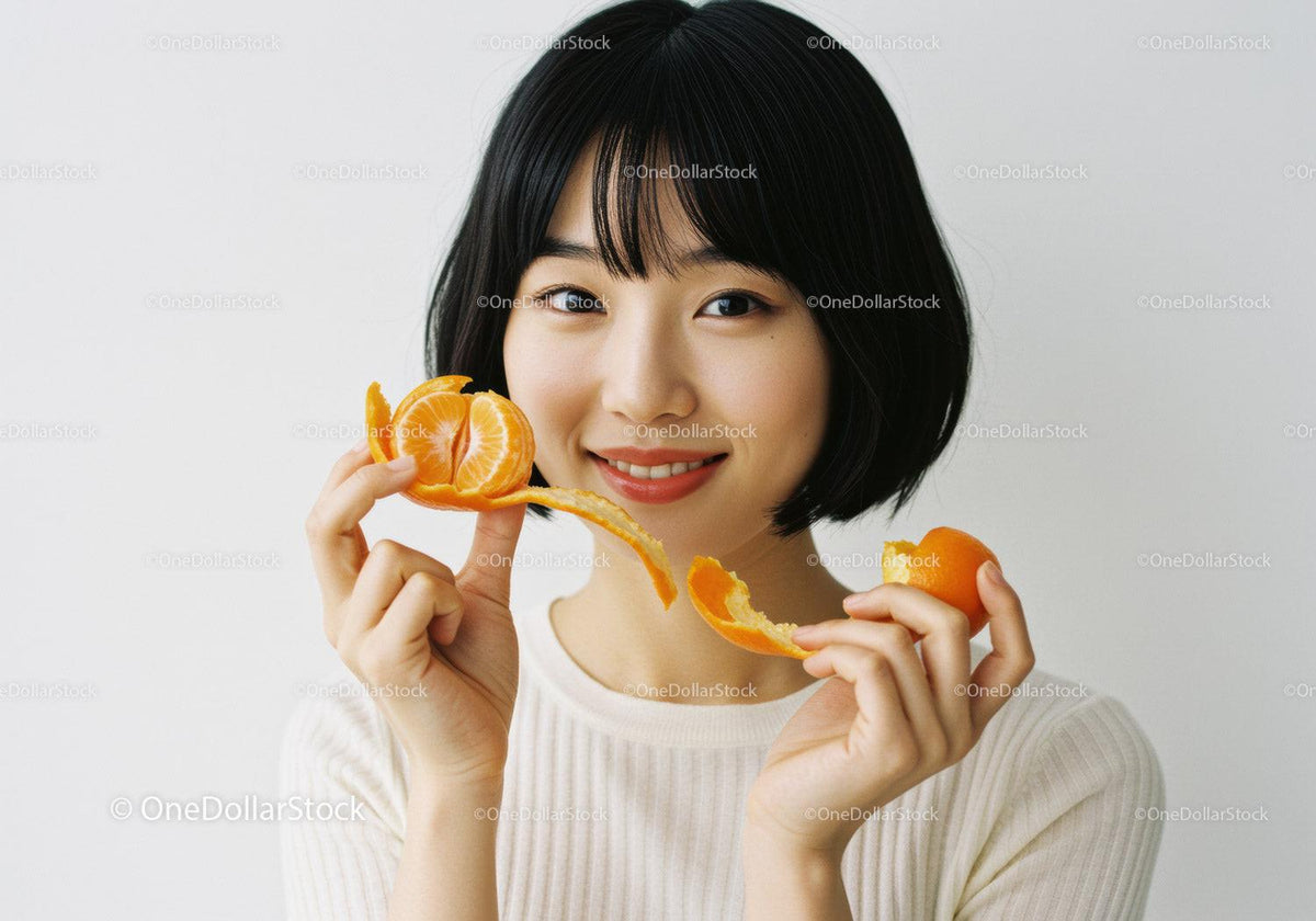 Young Woman Enjoying Fresh Mandarin Slices Smiling Brightly