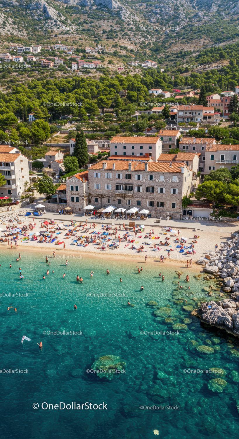 Scenic Beach with Mountain Backdrop and Vibrant Sunbathers