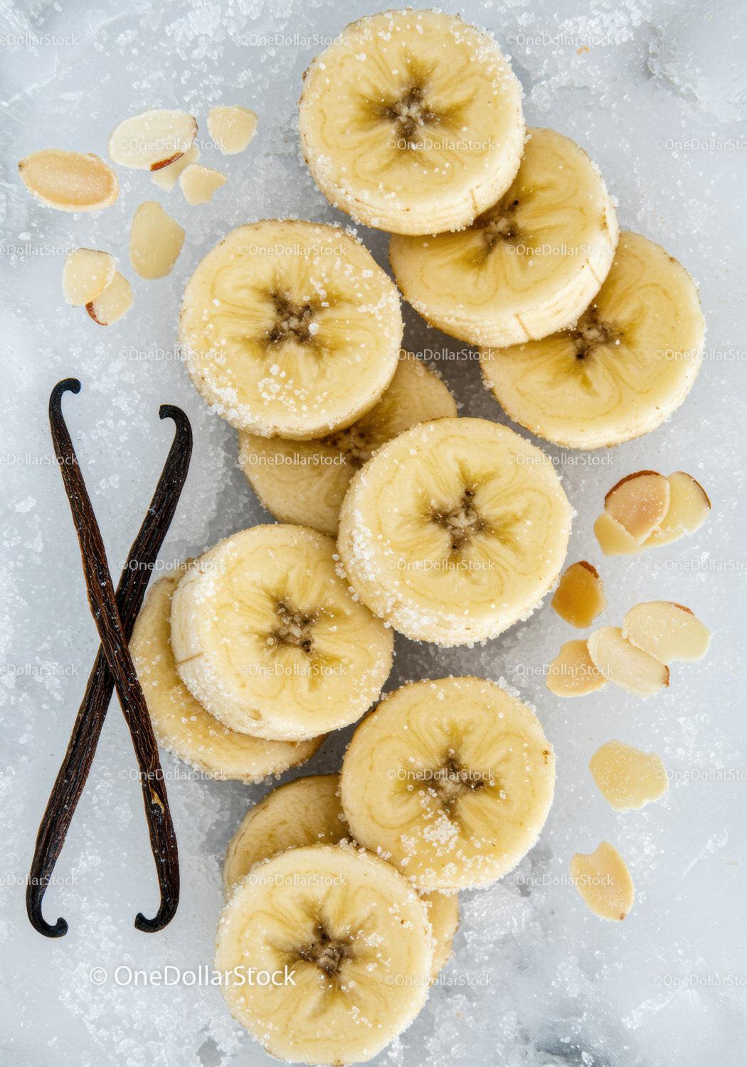 Frozen banana slices with vanilla and almond flakes