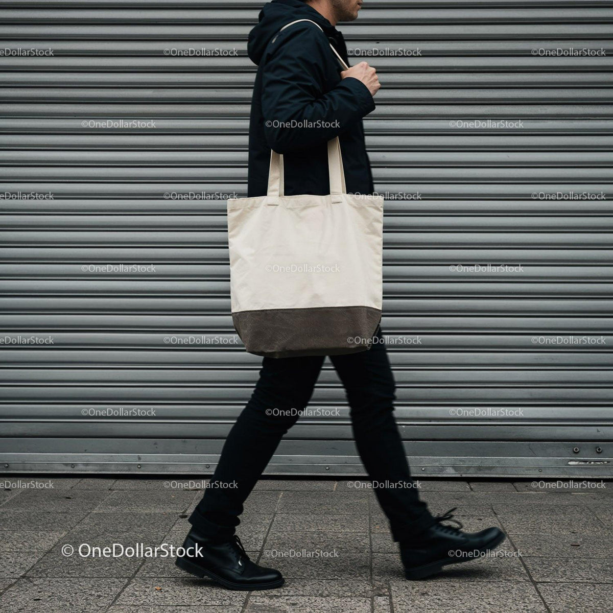 Man walking with canvas tote bag on city street JPG Mockup Image preview