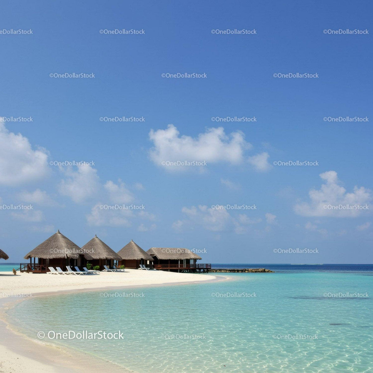 Tropical Beach with Overwater Bavilions and Clear Turquoise Water