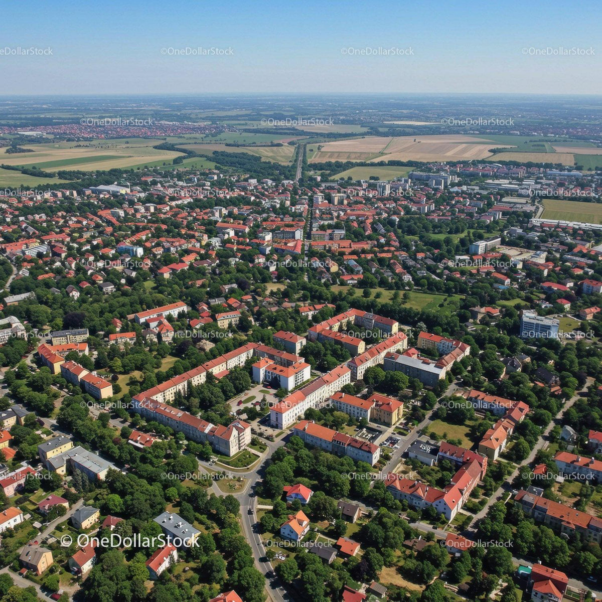 Aerial View of Suburban Neighborhood with Red Roofs and Green Parks