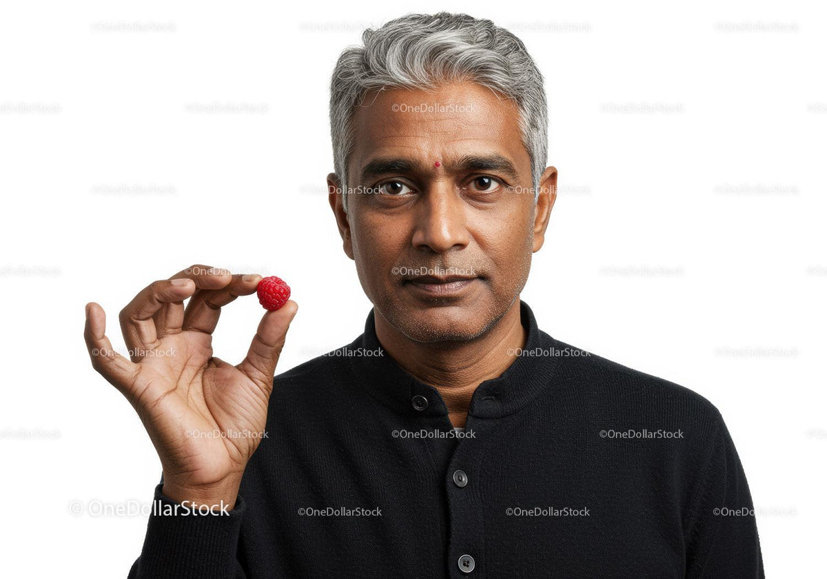 Healthy Mature Man Holding Raspberry on White Background