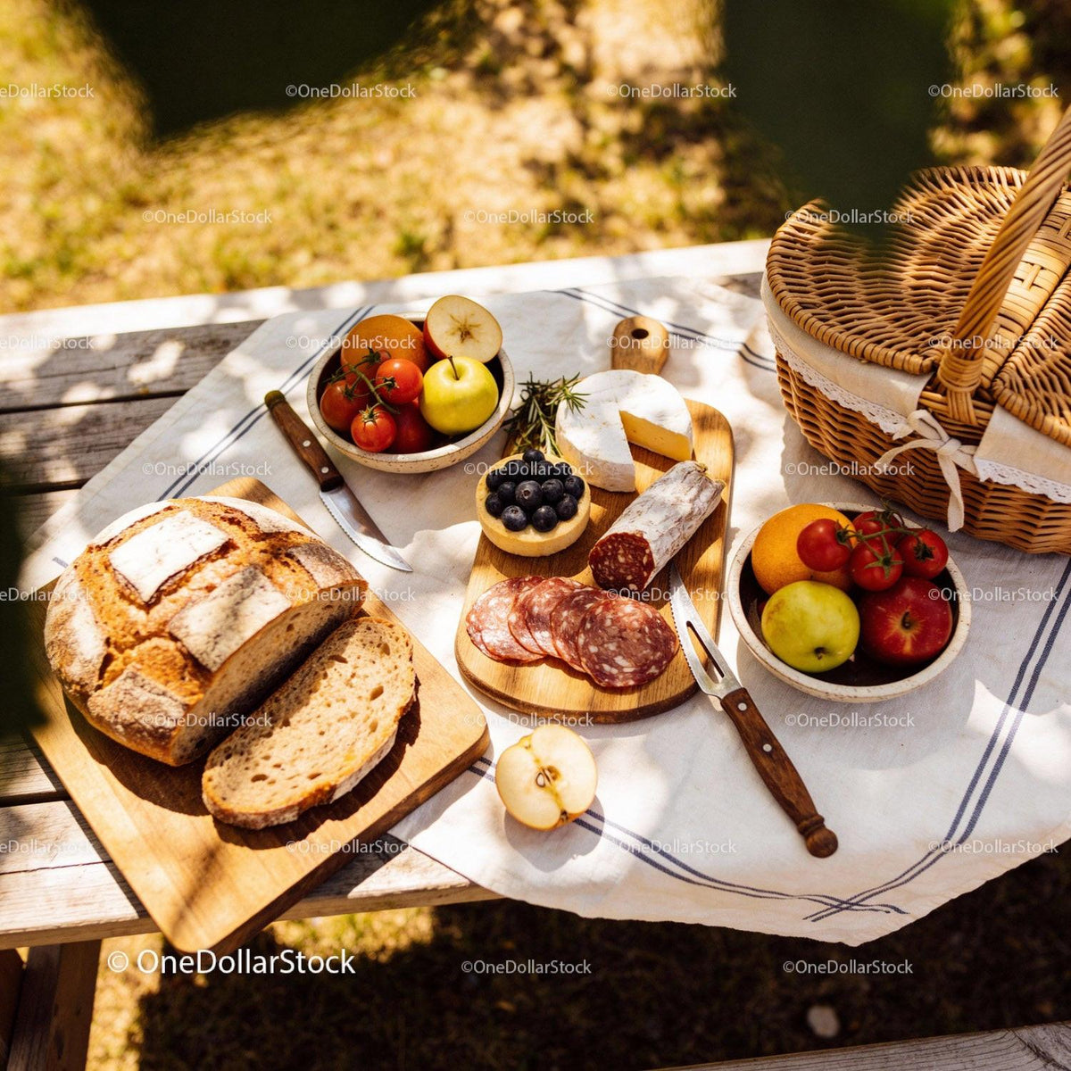 Rustic Picnic Setting with Fresh Bread and Cheese