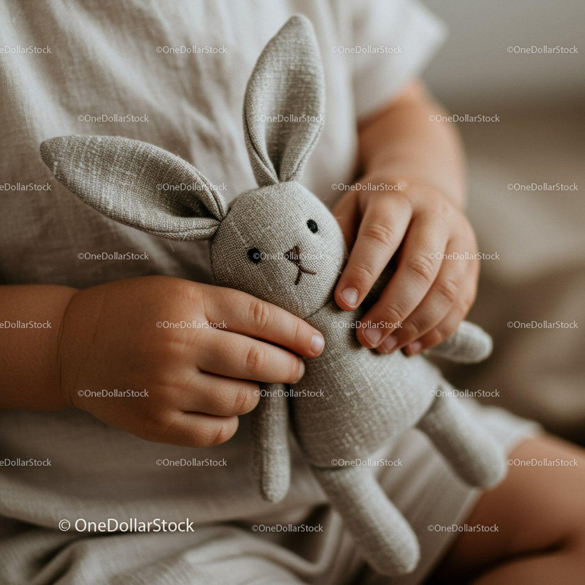 Toddler holding soft knitted bunny plush toy close