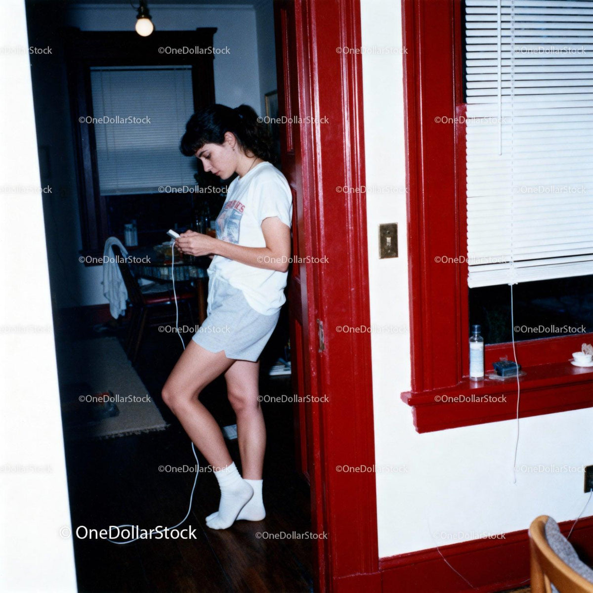Young Woman Listening to Music with Classic Walkman