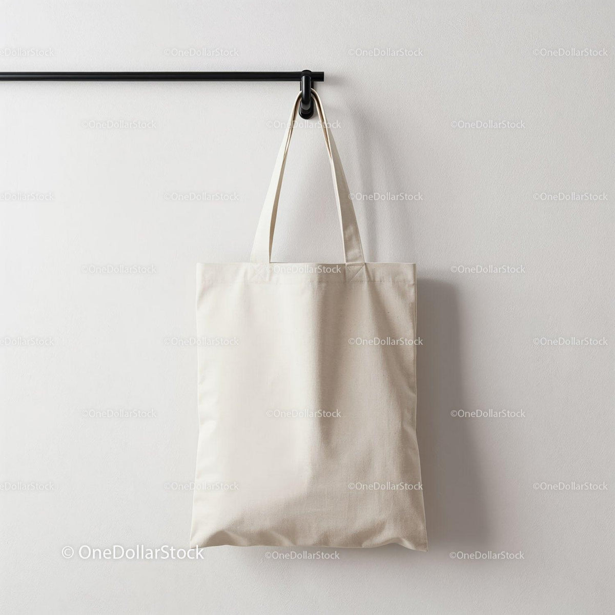 Minimalist white canvas tote bag hanging on hook JPG Mockup Image preview