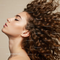 Profile of woman with flowing curly brown hair