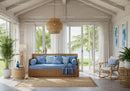 Cozy coastal living room with wicker furniture and blue accents