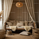 Cozy neutral-toned living space with layered textiles
