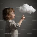 Curious toddler reaching toward a fluffy cloud indoors