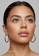 Beautiful Young Woman with Brown Eyes and Gold Hoop Earrings