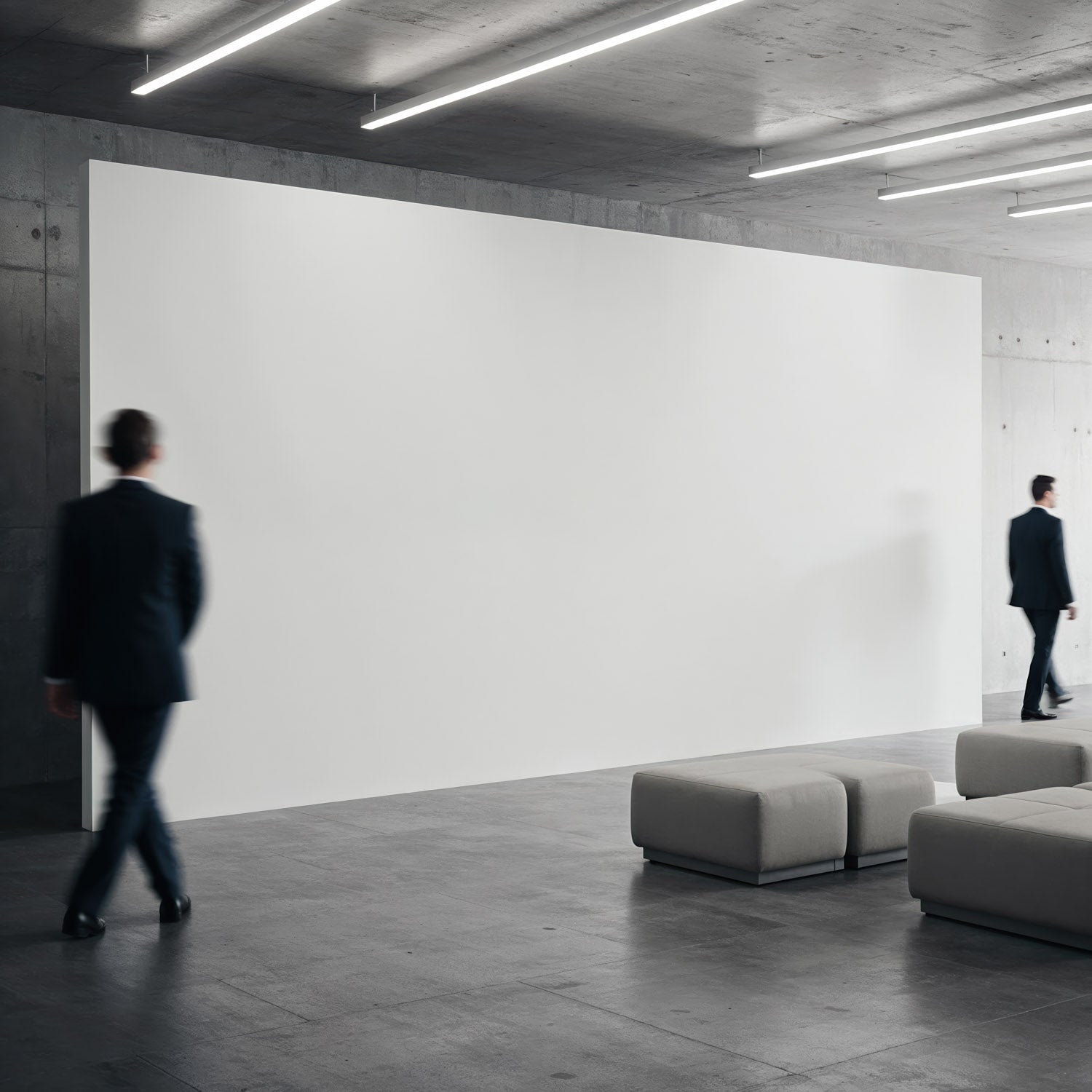 Businessmen walking in modern minimalist lobby with blank wall