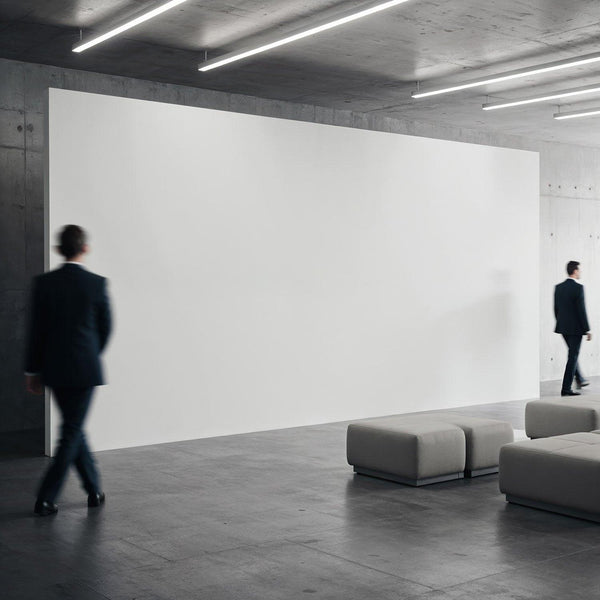 Businessmen walking in modern minimalist lobby with blank wall JPG Mockup Image