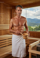 Male Relaxing in Wooden Sauna with Mountain View