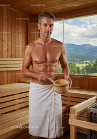 Male Relaxing in Wooden Sauna with Mountain View