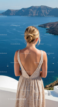 Woman in summer dress admiring deep blue sea view