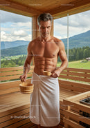 Muscular Man Relaxing in Sauna with Scenic Mountain View