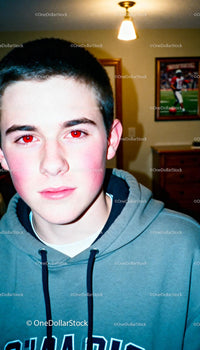 Teen boy with casual hoodie indoors portrait lighting