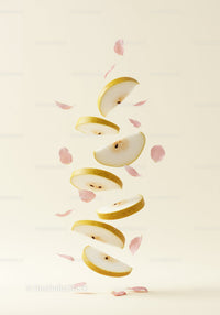 Sliced pear floating with delicate pink petals