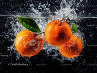 Fresh Oranges Splashing into Water with Green Leaves