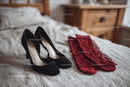 Chic Black Heels and a Red Lace Dress in a Cozy Bedroom Setting