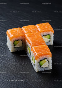Fresh salmon sushi rolls with avocado and cream cheese