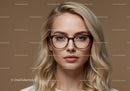 Stylish Woman with Blonde Hair and Glasses in Professional Portrait