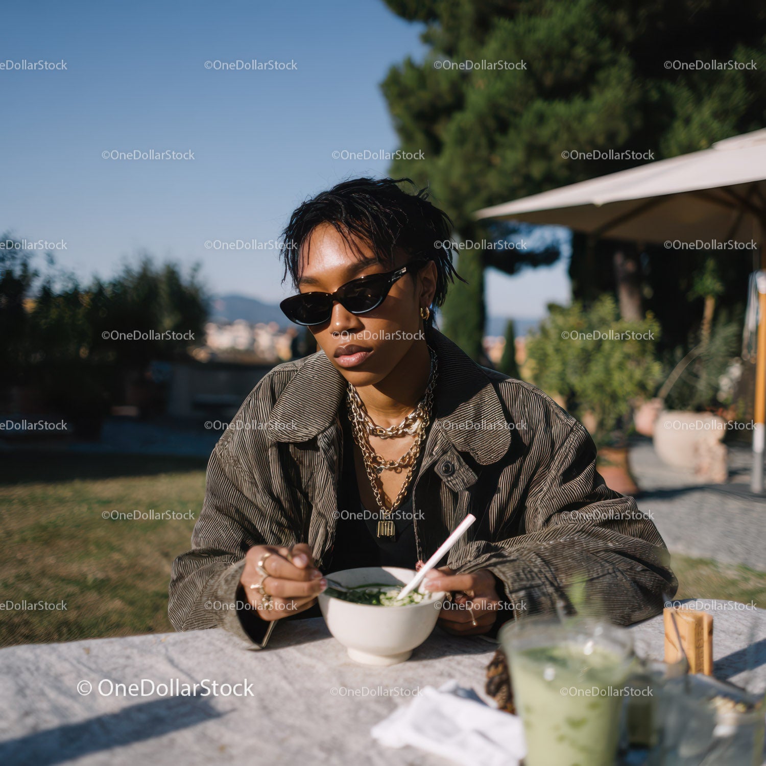 Stylish Woman Enjoying Salad Outdoors on Sunny Day