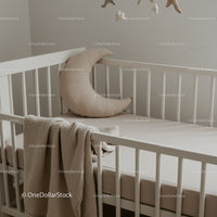 Minimalist Baby Crib with Crescent Moon Pillow and Blanket