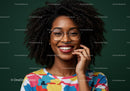 Portrait of a Smiling Woman with Curly Hair and Glasses in Vibrant Colors