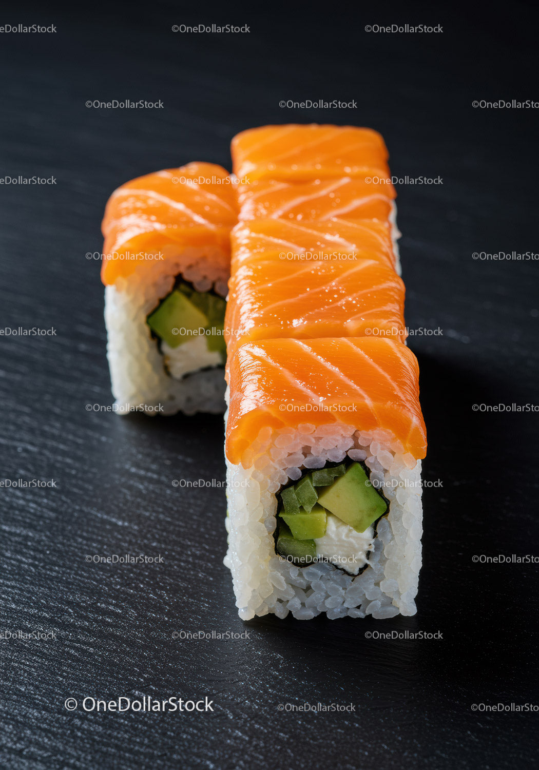 Fresh salmon sushi rolls with avocado and cream cheese