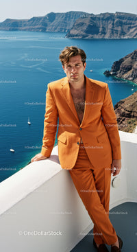 Man in Orange Suit Relaxing by Coastal Cliffside View
