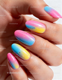 Close up of colorful gradient nail art with glitter