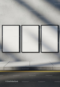 Minimalist three blank poster frames on street wall