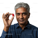 Portrait of a Confident Man Holding Raspberry Against White Background