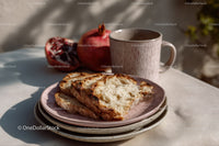 Fresh Sliced Bread with Pomegranate and Coffee Mug on Rustic Table