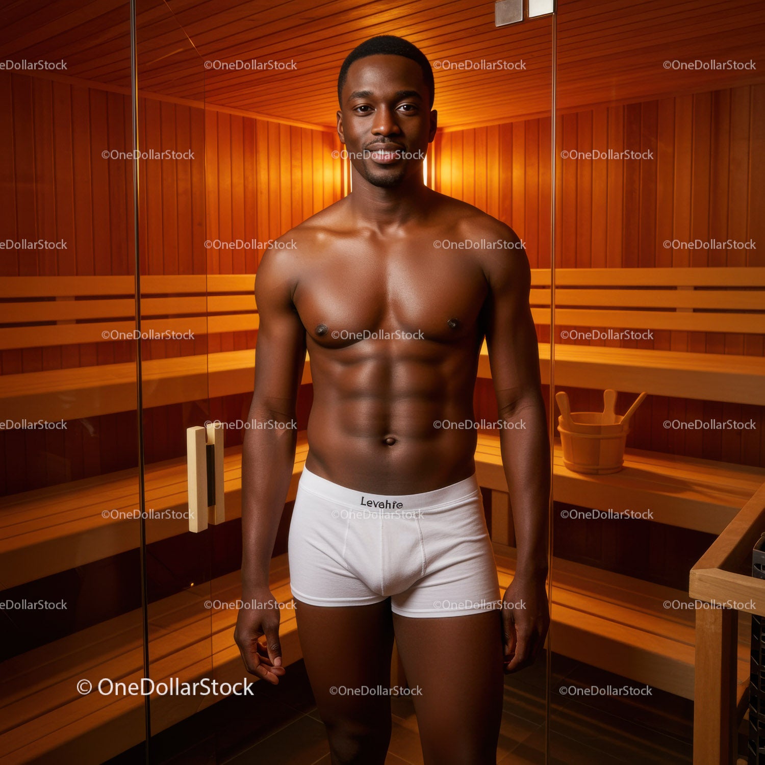 Muscular Man in Sauna Room with Wooden Interior for Relaxation