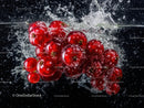 Fresh Red Currants Splashing into Water in Vivid Close-Up
