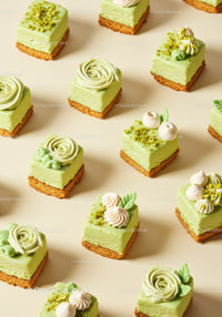 Assorted Mini Green Tea Cheesecake Desserts on Beige Background