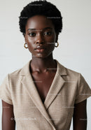 Elegant Black Woman in Beige Blazer for Professional Portrait