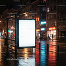 Illuminated Bus Stop Billboard in a Night Urban Scene