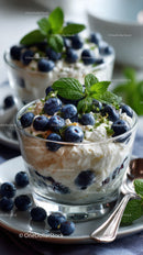 Berry Cheesecake in Glass Cup with Fresh Mint and Blueberries