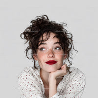 Young Woman with Curly Hair and Red Lipstick in Portrait